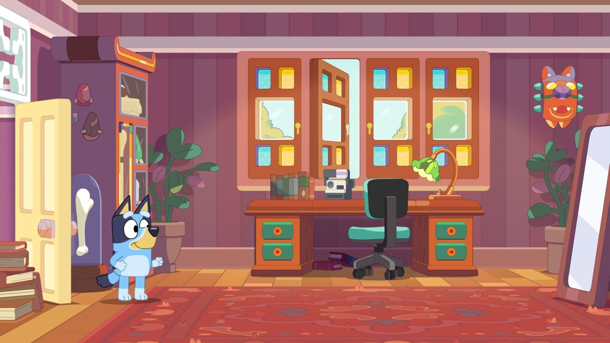 Official Bluey's Happy Snaps screenshot showing Bluey beside the doorway of a colorful home office
