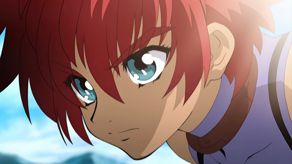 Official Tales of Eternia Remastered promotional still showing a close-up of red-haired Reid against a bright sky