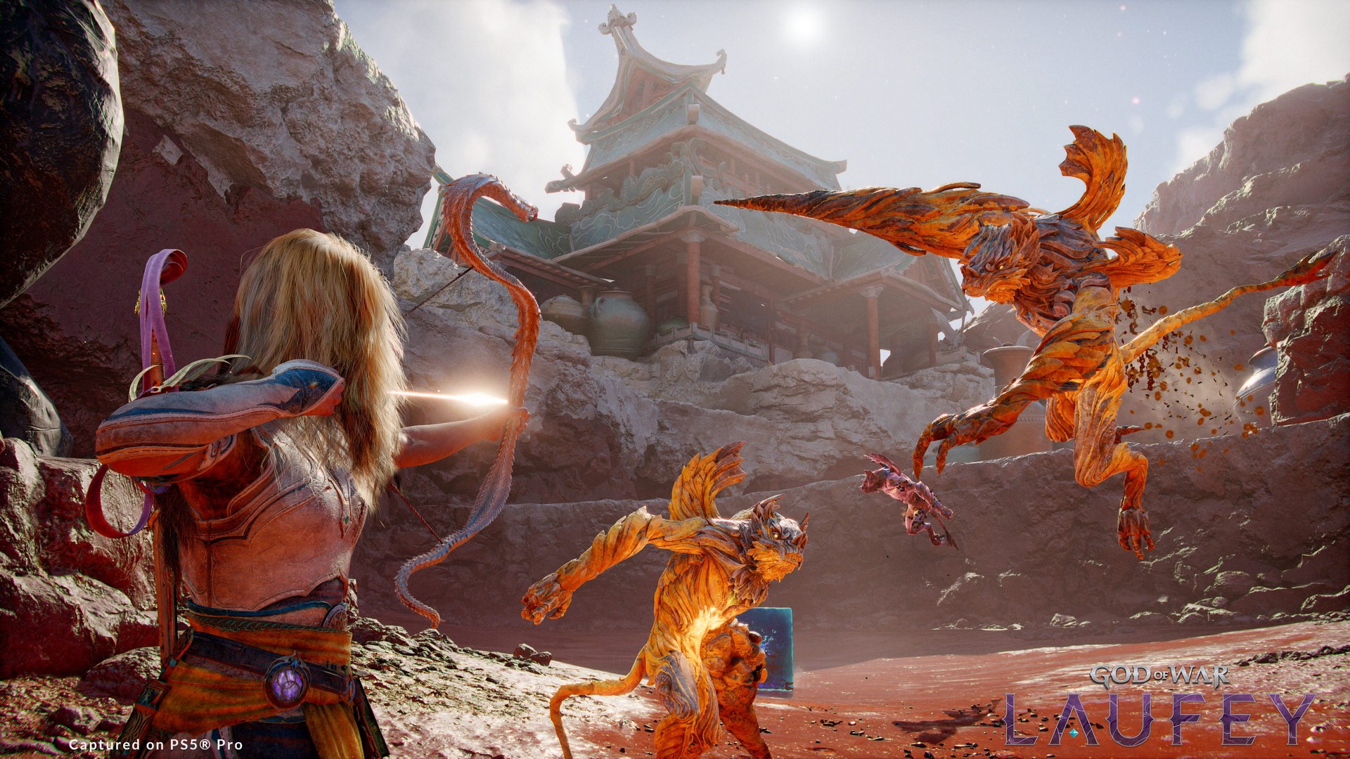 Official God of War Laufey screenshot of Faye drawing the Serpent Bow against fiery creatures, captured on PS5 Pro