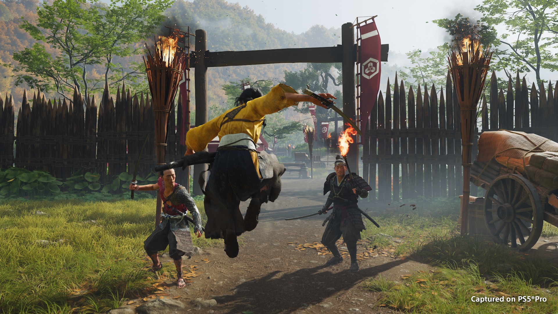 Official Ghost of Yōtei combat screenshot of Atsu leaping into a fight at a wooden gate