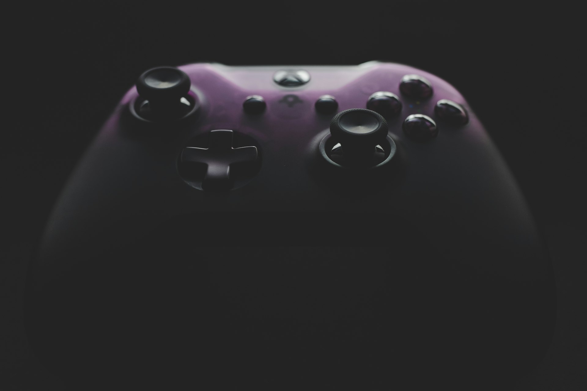 Black Xbox One game controller on a dark surface — Unsplash photo for Game Pass Weekly Poll